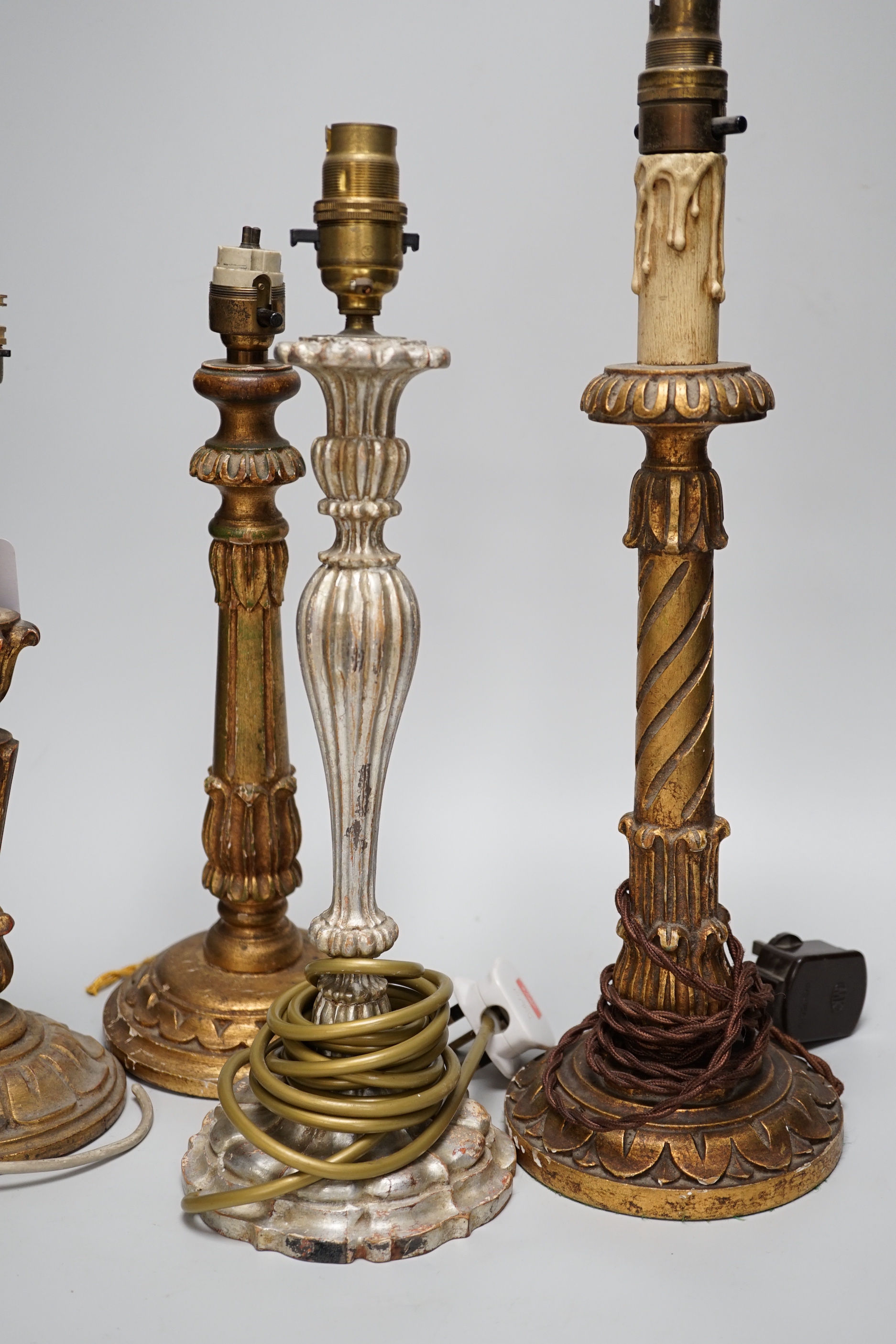Four antique-style gilt and silvered wood table lamps, the largest 43cm high including the fitting